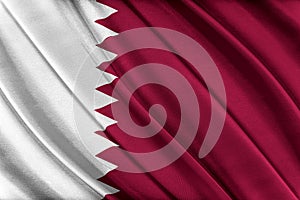 Colorful Qatar flag waving in the wind. photo