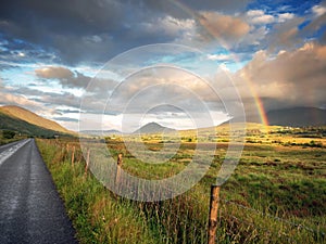 Colorful rainbow in a green field, Beautiful rich sky, Connemara loop, Ireland