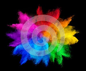 Colorful rainbow holi paint color powder explosion isolated on dark black background. peace rgb gaming beautiful party concept