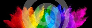 Colorful rainbow holi paint color powder explosion isolated dark black wide panorama background. peace rgb beautiful party concept