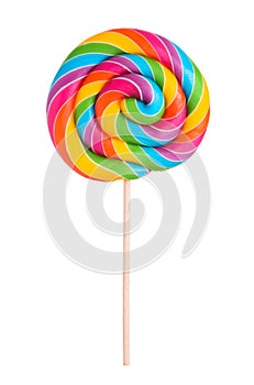 Colorful rainbow lollipop swirl on wooden stick isolated