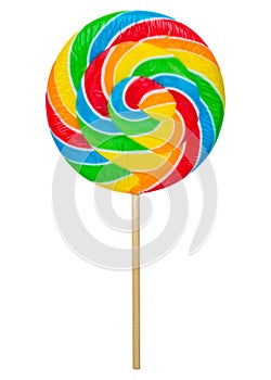 Colorful rainbow lollipop twisted on wooden stick isolated on white background. Caramel is spiral twisted into a large circle or r