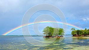 Colorful rainbow over caribbean sea .Travel background.