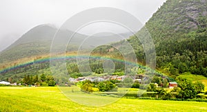 Colorful rainbow over the fields, lake and houses of Skei village, JÃƒÂ¸lster in Sogn og Fjordane county, Norway