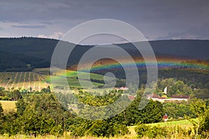 Colorful rainbow over mountains