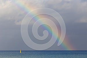 Colorful rainbow over the sea