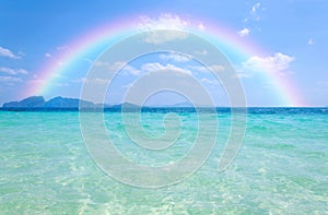 Colorful rainbow over a Tropical beach of Andaman Sea, Thailand