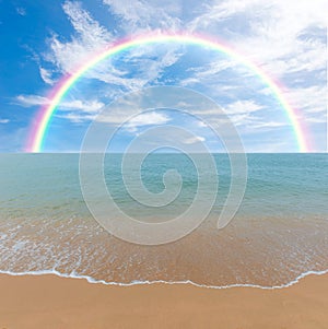 Colorful rainbow over a Tropical beach of Andaman Sea, Thailand