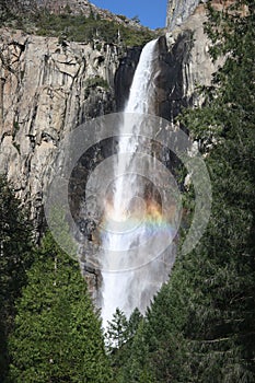 Colorful rainbow over Yosemite fall