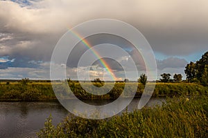 Colorful Ranibow over the falls and water