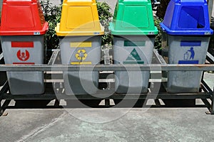 A colorful recycle bins on pallet in the park, enviroment concepts