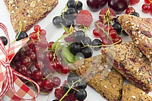 Colorful red berry fruit falling out of decorated box and integr