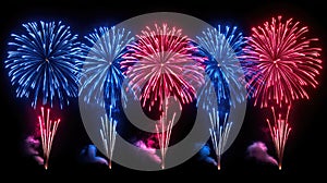 Colorful red and blue fireworks exploding in night sky celebration