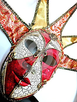 Colorful red Carnival mask venetian isolated photo