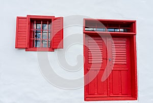 Colorful red pink door desing on white wall