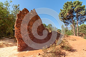 Colorful red rock formations ocher in the Colorado Provenzal in Provence Luberon France