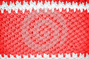 Colorful red and white crochet knitted patterns texture for background