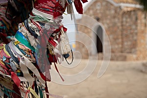 Colorful religious talisman on tree. Orthodox, catholic Christians prayers. Faith and religion