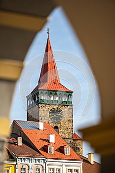 Colorful renaissance houses and Valdice Gate at Wallenstein Square in Jicin