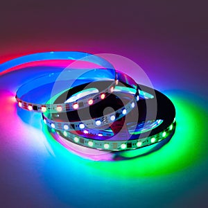 Colorful RGB glowing smart LED garland strip christmas lights on reel