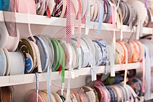 Colorful ribbons on counter in store