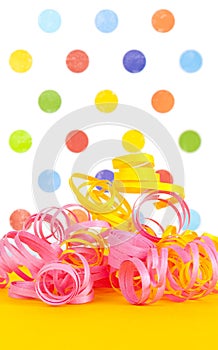 Colorful ribbons with a polka dot background