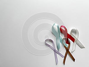 Colorful ribbons on white background, cancer awareness