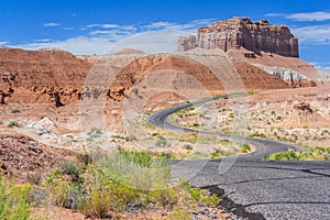 Colorful road in desert painted with different color sediments and rocks near Goblin Valley State Park Utah USA