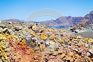 Colorful rocky landscape Nea Kameni volcanic island Santorini Caldera Greece