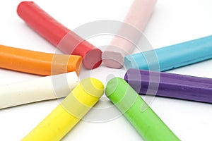 Colorful rod plasticine arranging on white background