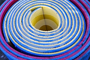 Colorful rolled caremat texture. Macro