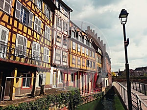 Colorful romantic city Strasbourg, France, Alsace. Traditional houses near the river. Medieval home facade, historic town