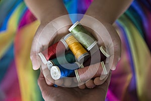 The colorful ropes on the hand on background.