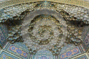 Colorful and rosy mosaic  patterns on the ceiling of Nasir Al-Mulk Mosque Pink Mosque in Shiraz, Iran