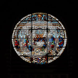 Colorful round vitrage in village church photo