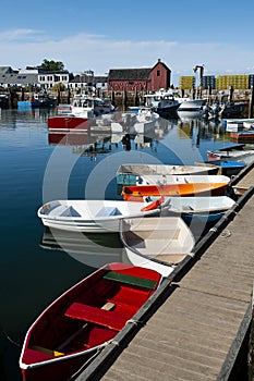 Colorful Rowboats Moored by Famous Red Fishing Shack in Rockport Harbor in Massacusetts