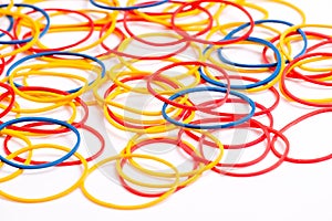 Colorful Rubber Bands arranged on a white background