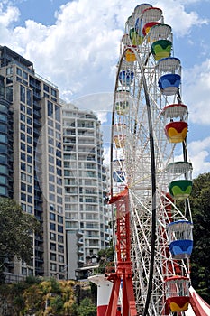 Colorful Russian wheel among apartment buildings