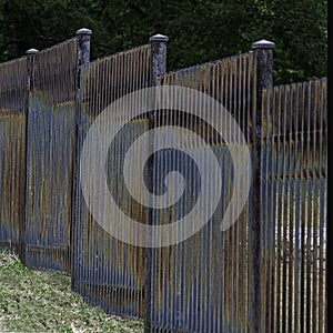 Colorful Rusted Slat Iron Fence