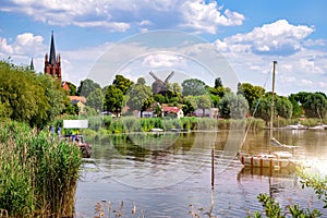 Colorful sailboat in front of a little river island, witch is part of the town Werder, Havel photo