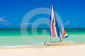 Colorful sailing boat in a cuban beach