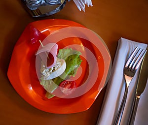 Colorful salad is decorated in form of ship. idea for children menu