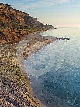 Colorful sand cliffs and empty beach