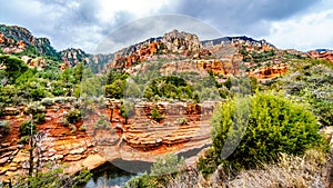 The colorful sandstone mountains and canyon carved by Oak Creek at famous Slide Rock State Park along Arizona SR89A