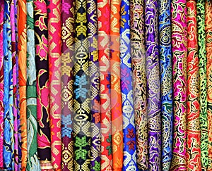 Colorful sarongs for sale at the art and craft market of Ubud Bali Indonesia