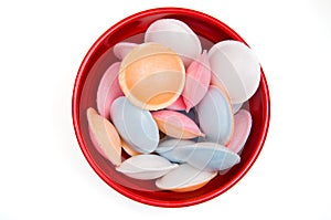 Colorful Satellite Wafers Candies in a Red Bowl Isolated on White