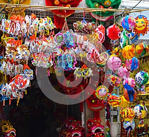 Colorful scene, friendly vendor on Hang Ma lantern street, lantern at open air market, traditional culture on mid autumn, Vietnam