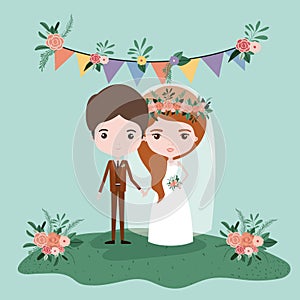 Colorful scene with pennants decorative and grass with couple of just married under