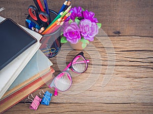 Colorful school supplies with books
