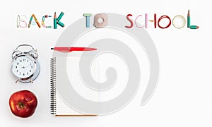 Colorful school supplies corner border over a white background with words Back to school